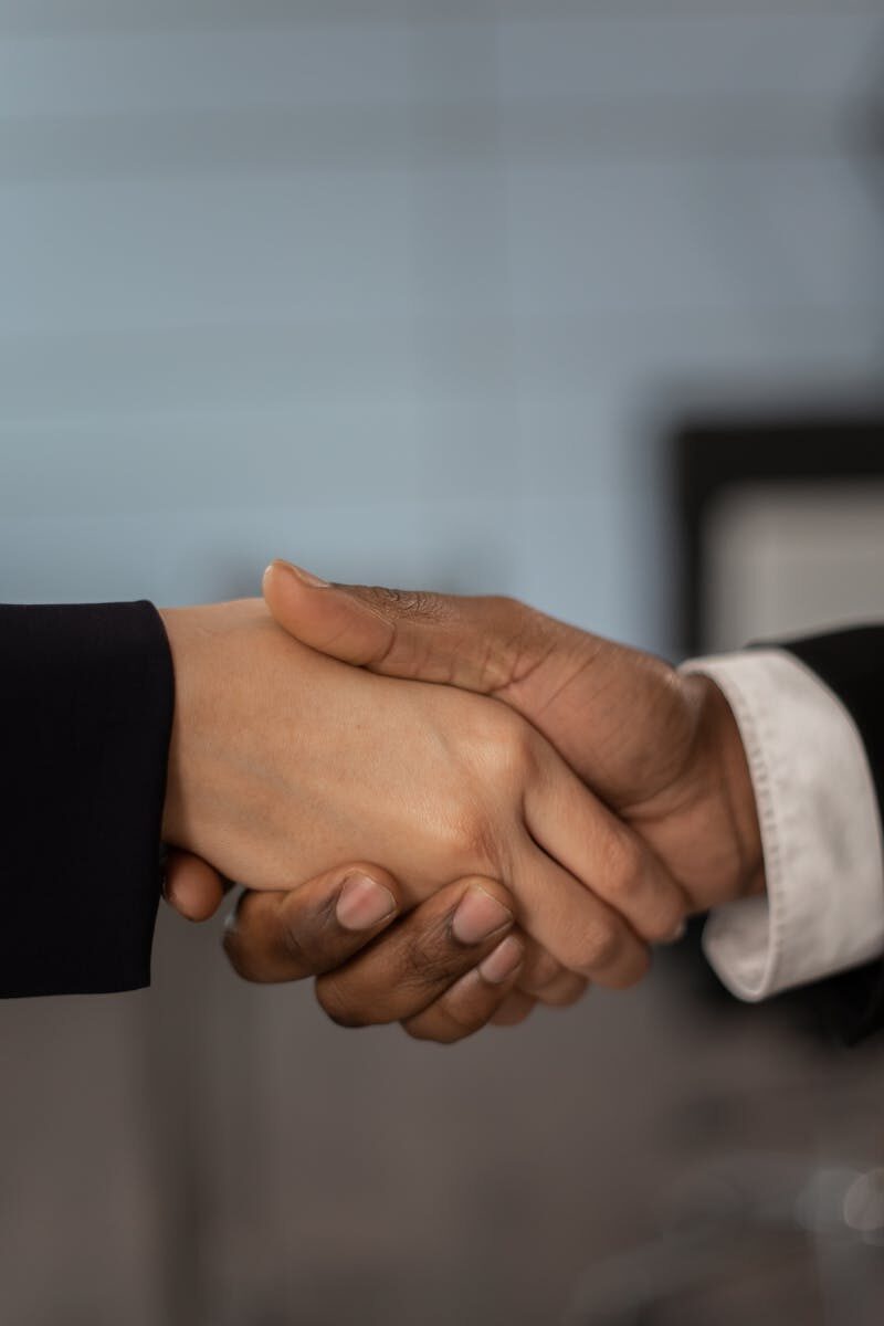 Close-up of a professional handshake symbolizing business partnership and agreement.